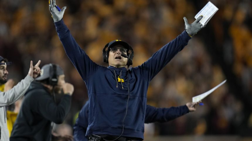 No. 2 Michigan romps past Minnesota 52-10 with pair of pick-6s for 17th straight win in Big Ten