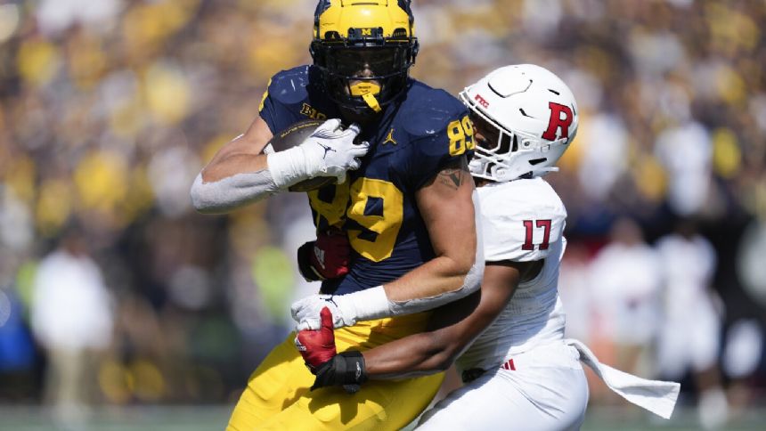 No. 2 Michigan visits Nebraska for first road game. The teams are among eight with 900 all-time wins