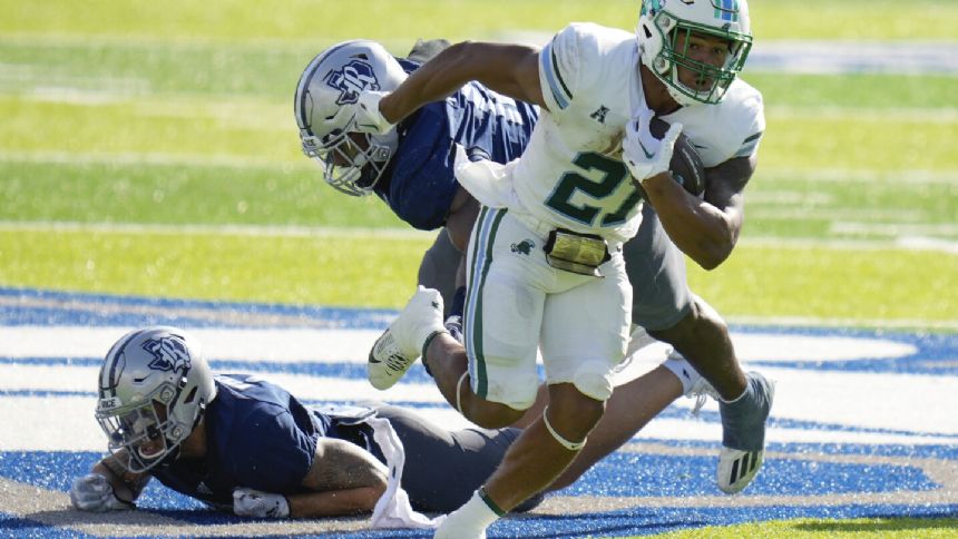 No. 21 Tulane visits East Carolina looking to stay unbeaten in AAC race