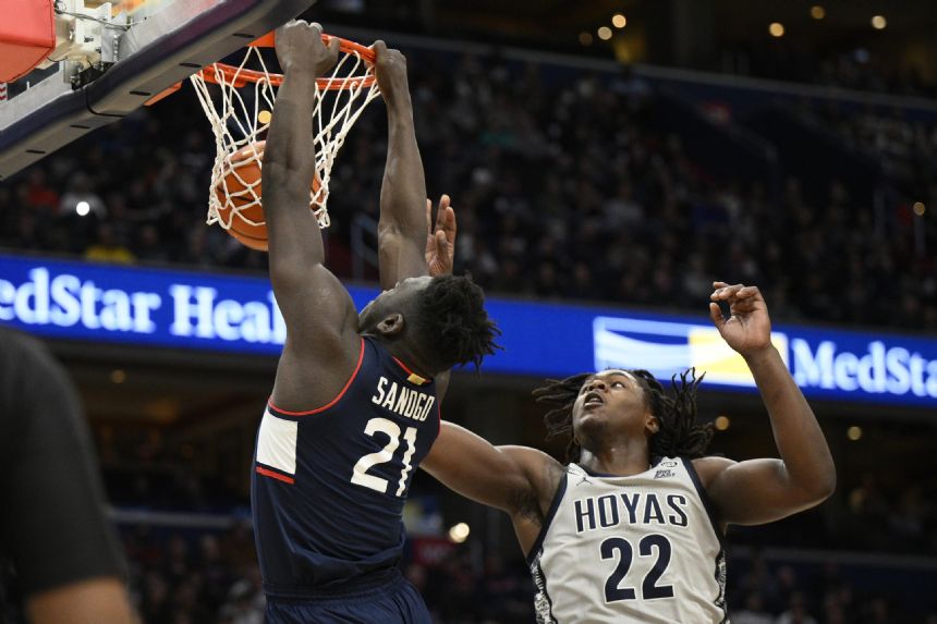 No. 24 UConn uses late rally to beat last-place Georgetown