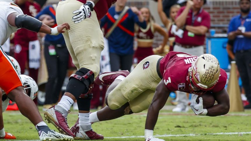 No. 4 Florida State beats Miami 27-20 to win its 16th straight and remain on track for CFP