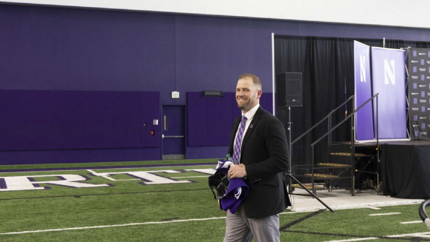 Northwestern president says Braun's support for players prompted school to lift 'interim' label