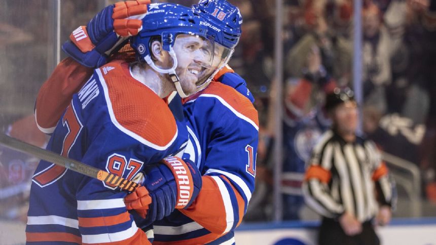 Oilers captain Connor McDavid becomes 4th player in NHL history to record 100 assists in a season