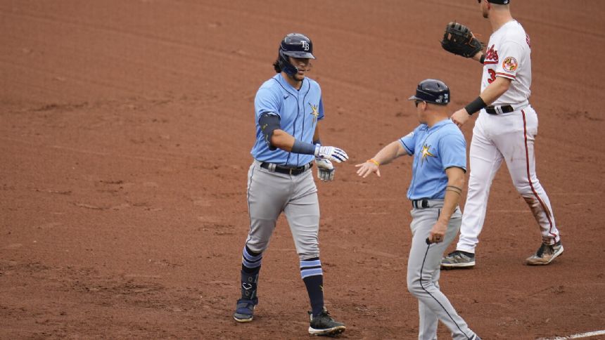 Orioles and Rays both clinch playoff berths when Rangers lose to Guardians