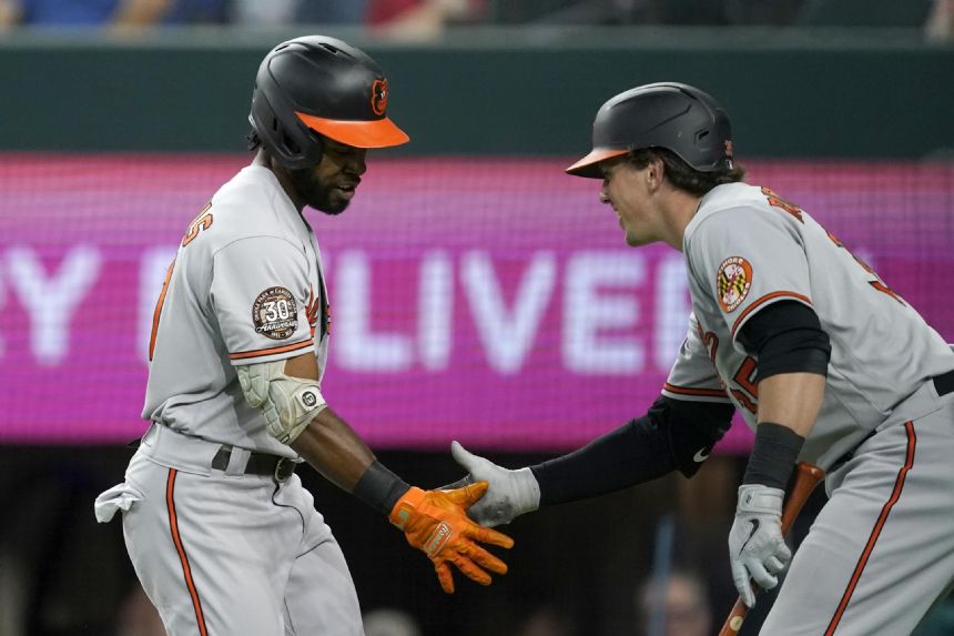 Orioles trade Mancini, then beat Texas 7-2 to match '21 wins