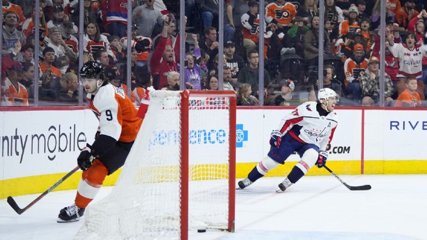 Oshie scores game-winner into empty net as Capitals make playoffs by beating Flyers