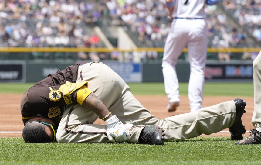 Padres star Machado takes tumble, exits with injured leg