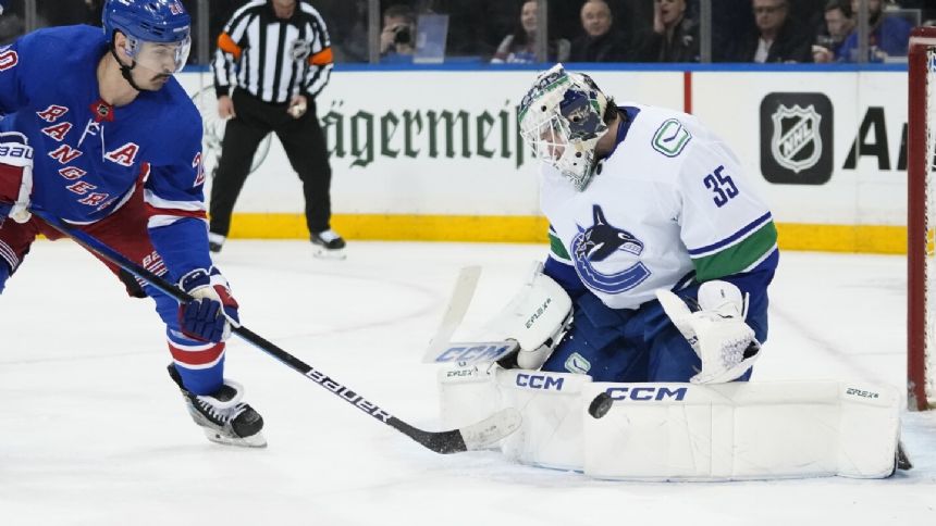 Pettersson, Hoglander score twice to lead the Canucks past the Rangers 6-3