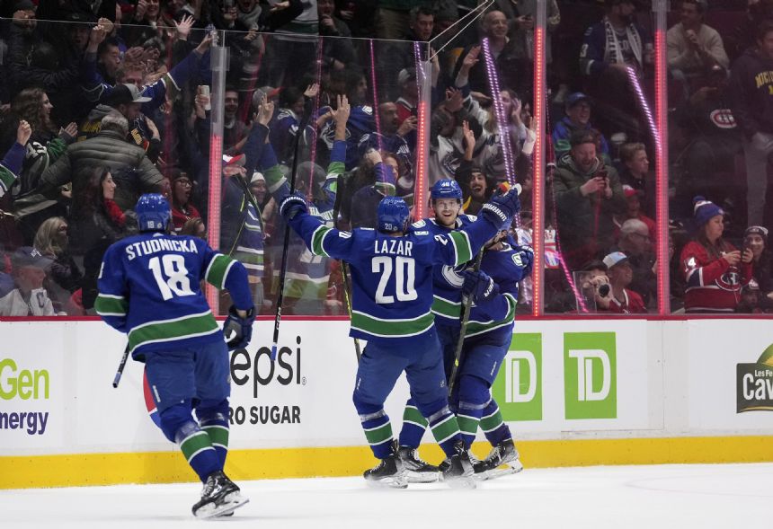 Pettersson scores early in OT, Canucks beat Canadiens 7-6