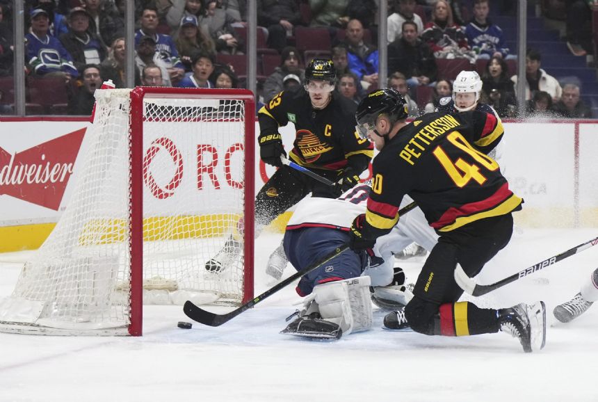 Pettersson scores twice, Canucks beat Blue Jackets 5-2