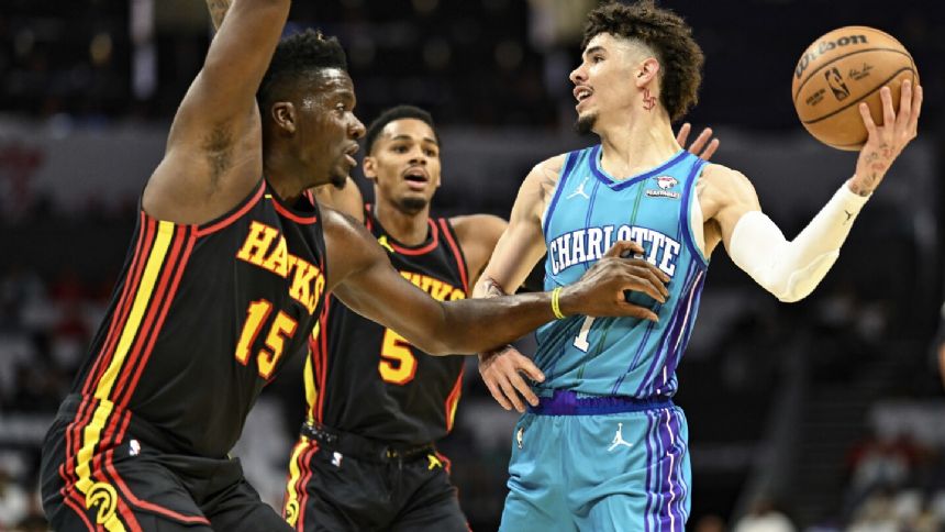 PJ Washington scores 25, rookie Brandon Miller provides spark as Hornets top Hawks 116-110 in opener