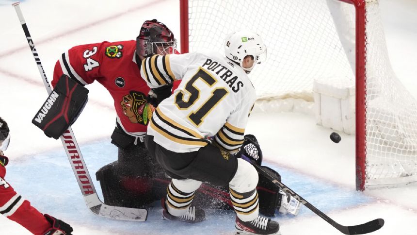 Poitras and Frederic help undefeated Boston Bruins blank Chicago Blackhawks 3-0