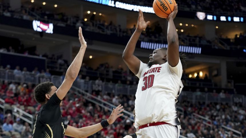 Powered by big man DJ Burns Jr., NC State muscles past Oakland in overtime to reach Sweet 16