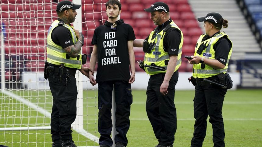 Protestor chains himself to a goalpost ahead of Scotland-Israel women's match