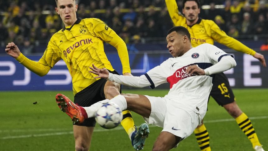 PSG squeezes into Champions League knockout stage with 1-1 draw at Borussia Dortmund