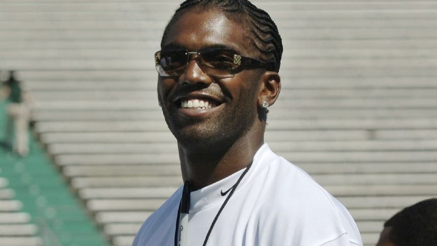 Randy Moss, Larry Fitzgerald are among 19 players and 3 coaches voted into College Football HOF