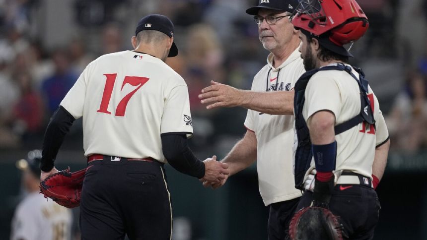 Rangers score go-ahead run on wild pitch to beat A's 3-2; only their 5th win in 21 games
