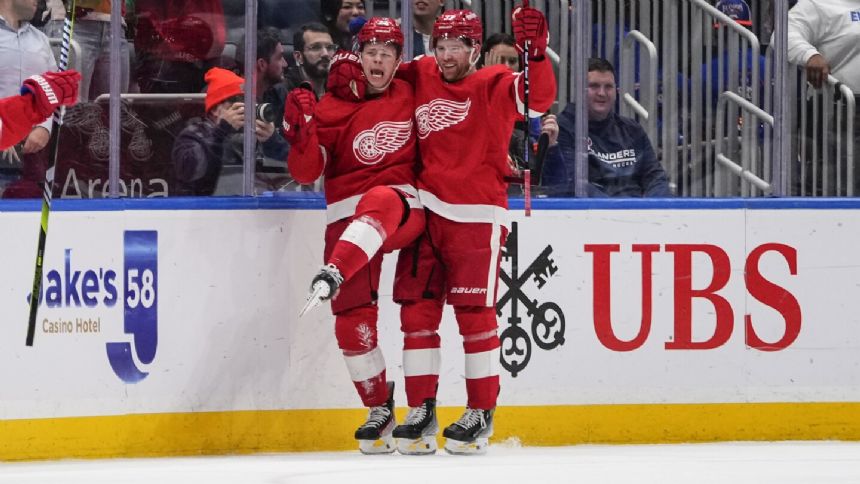 Raymond scores in overtime to lift Red Wings to 4-3 win over Islanders