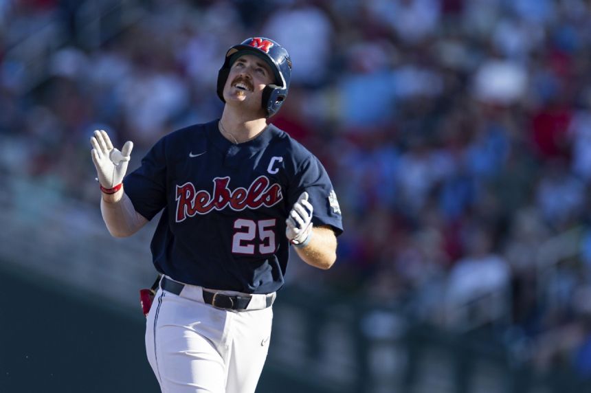 Rebels' roll continues in College World Series win over Hogs