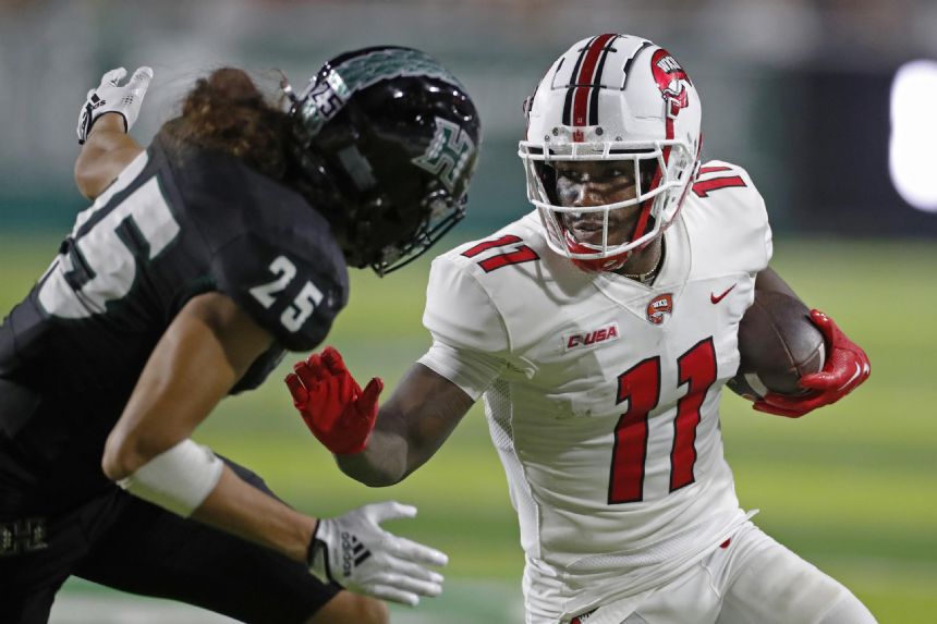 Reed propels Western Kentucky to 49-17 rout of Hawaii
