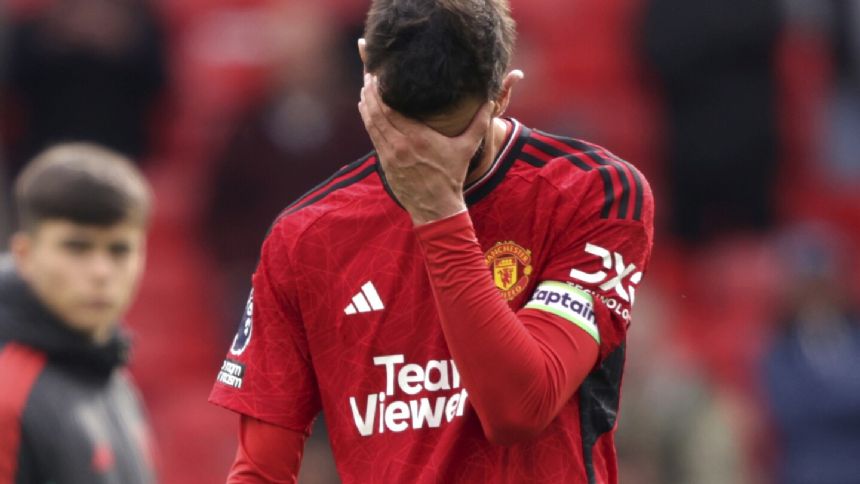 Relegation-threatened Burnley salvages draw at Man United with late penalty
