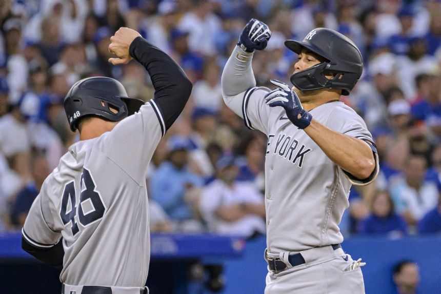 Rizzo slam in 8-run 5th, Yanks rout Jays 12-3 for 8th in row