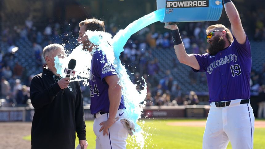 Rockies rally for 2 runs in 10th to beat Mariners 2-1 in 1st game of doubleheader