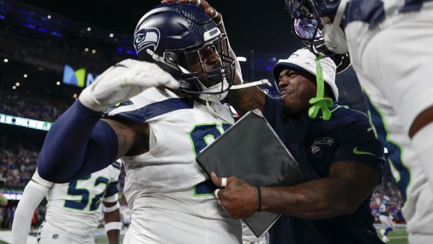 Rookie Devon Witherspoon scores on 97-yard pick six as Seahawks D leads Seattle over Giants