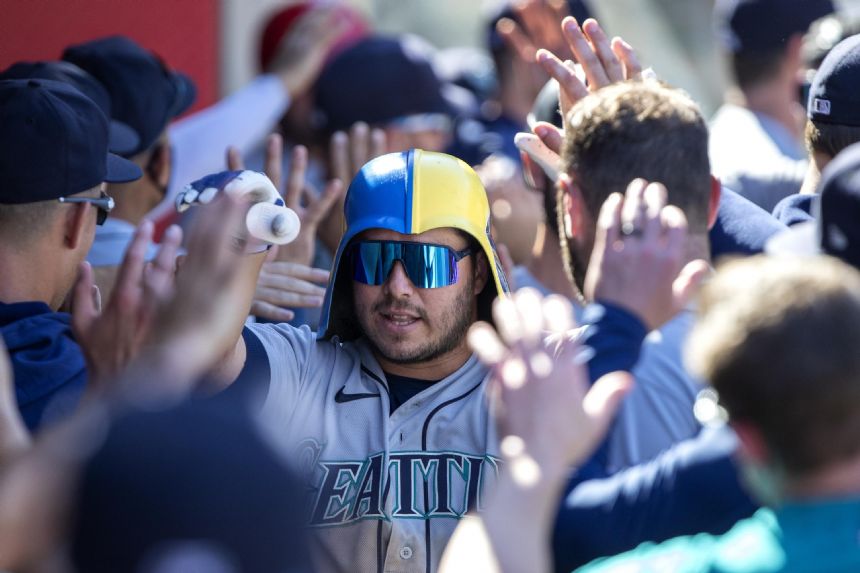 Santana homers twice, drives in 5; Mariners slam Angels 9-1