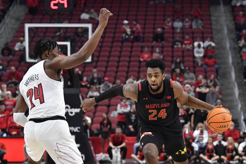 Scott scores 18, No. 22 Maryland blows out Louisville 79-54