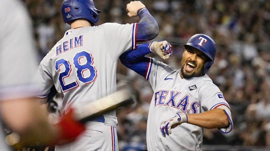 Semien's 5 RBIs, Seager's home run lead Rangers over Diamondbacks 11-7 for 3-1 World Series lead