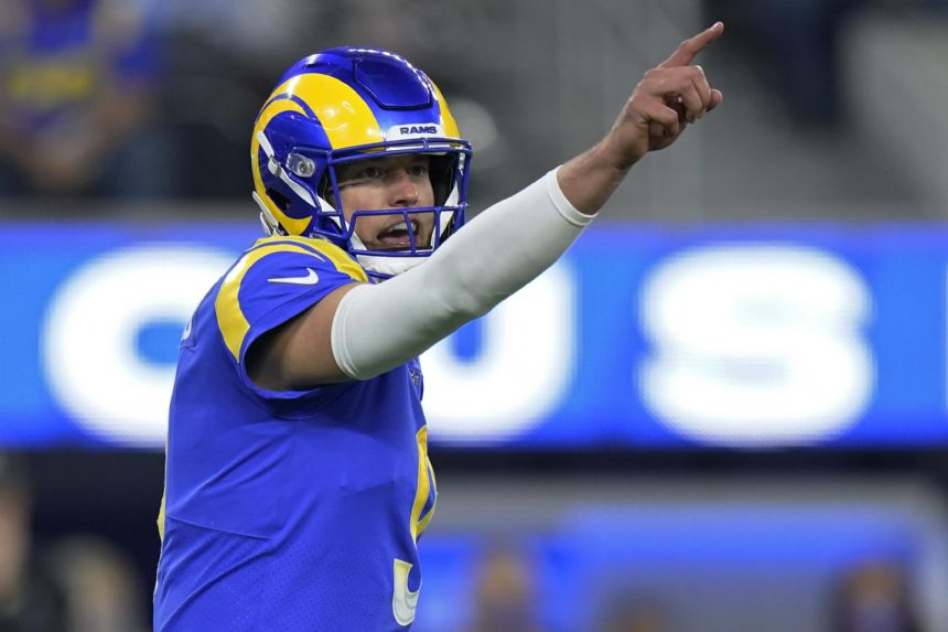 Stafford propels Rams past Cardinals 34-11 in playoff rout