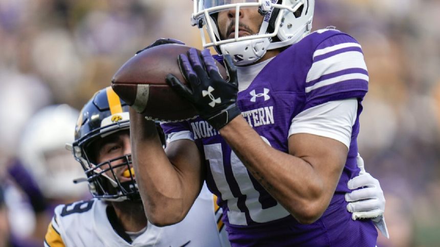 Stevens nails 53-yard field goal in closing seconds as Iowa beats Northwestern 10-7 at Wrigley