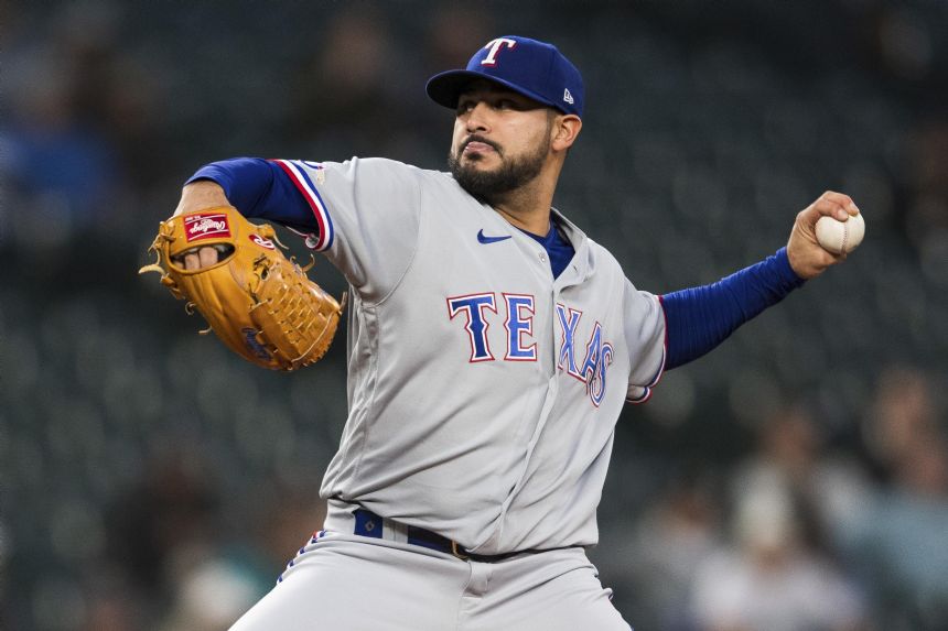 Texas All-Star lefty Perez accepts $19.65M qualifying offer