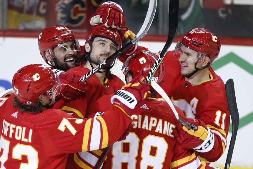 Tkachuk scores 40th, Flames beat Stars to win Pacific title