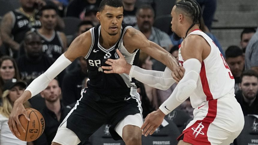 Top pick Wembanyama posts 19 points, 10 rebounds as Spurs knock off Rockets 126-122 in OT