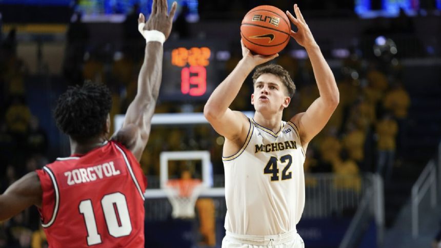 Tschetter and Nkamhoua combine for 15-of-15 shooting as Michigan beats Youngstown State 92-62