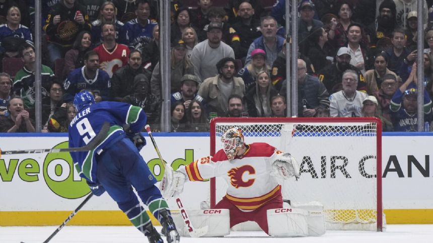 Tyler Myers, Thatcher Demko help Canucks beat Flames 4-1 to clinch Pacific Division title