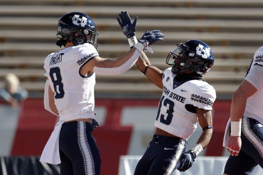 Utah State makes MWC title game with 35-10 win over NM