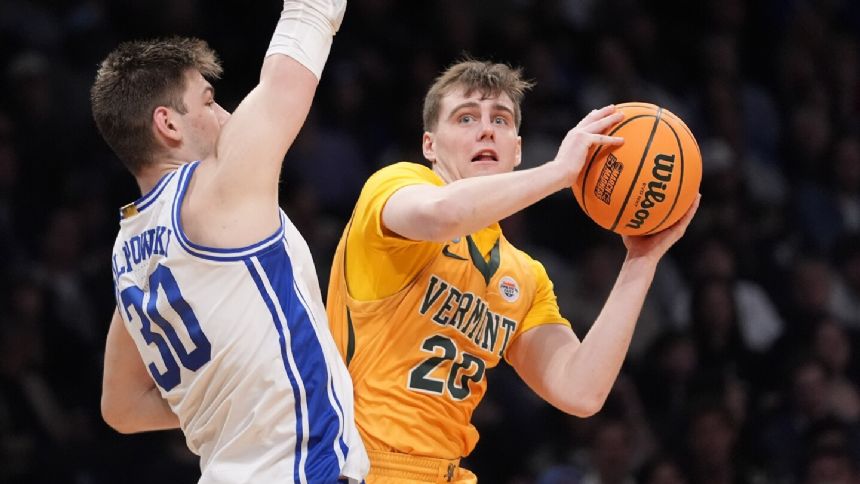 Vermont scoring leader TJ Long helped off court after right leg injury late in NCAA loss to Duke