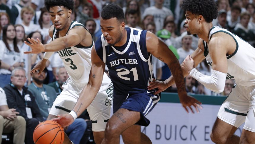 Walker scores 21, leads No. 18 Michigan State to a 74-54 win over Butler