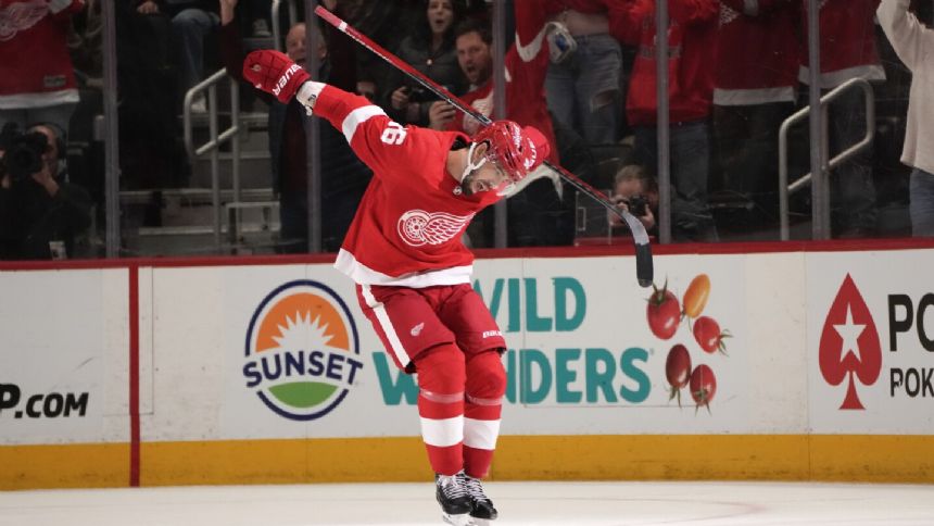 Walman scores on penalty shot in OT to give Red Wings 4-3 win over Canucks