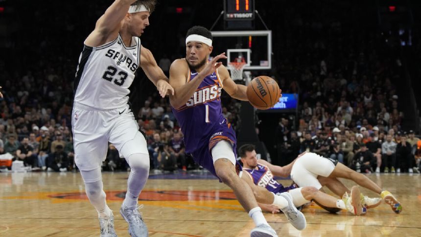 Wembanyama scores 38 points, shines in 4th quarter, as Spurs hold off Suns 132-121