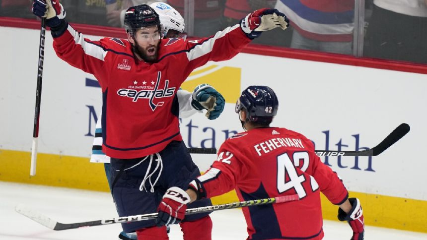 Wilson helps Capitals rally late to hand Sharks 9th straight loss to open season