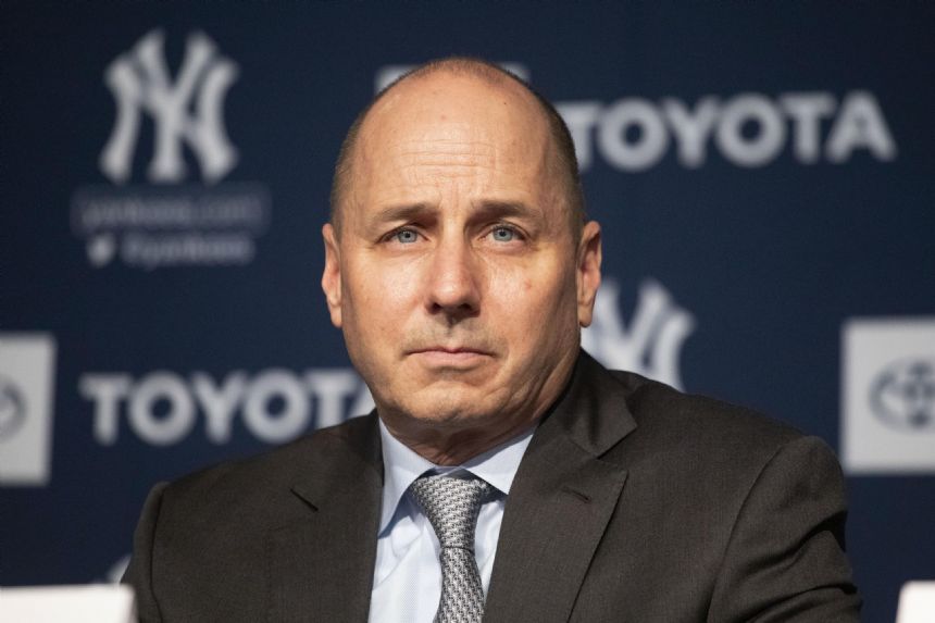 Yankees GM Cashman brushes off Crane's scandal comments