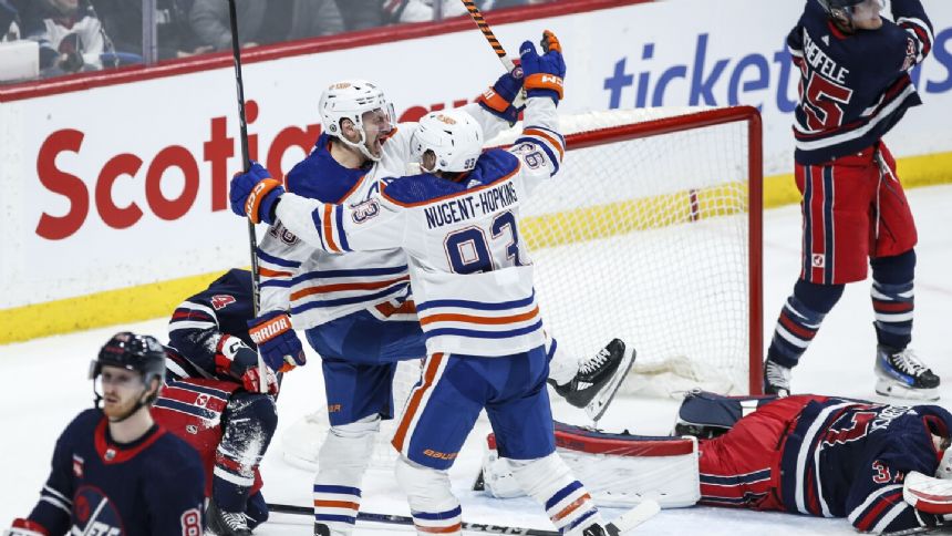 Zach Hyman scores 51st early in overtime, lifting the Oilers past the Jets 4-3